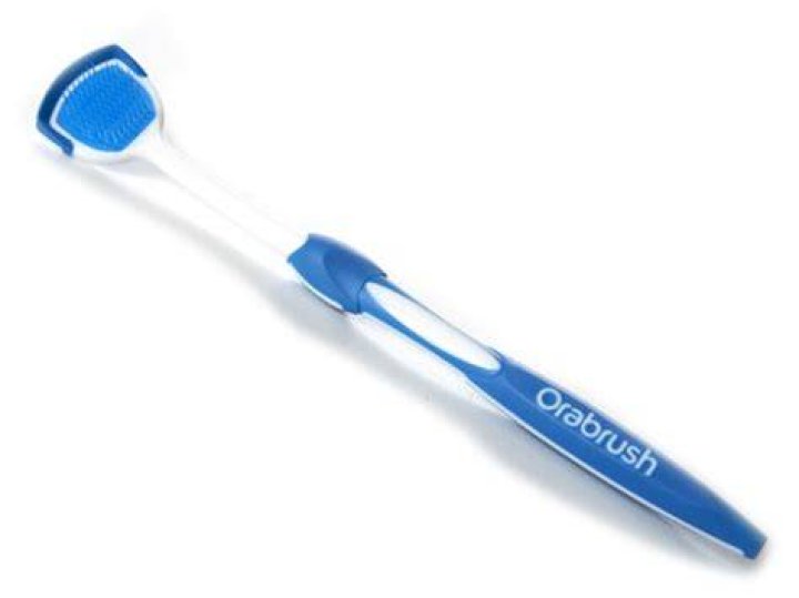 How do you use Orabrush tongue cleaner?